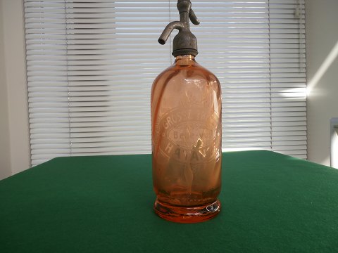 Siphon bottle in orange glass, France, approximately 1920.