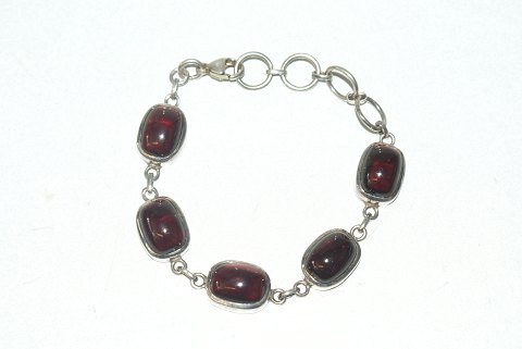 Elegant silver bracelet with red stones