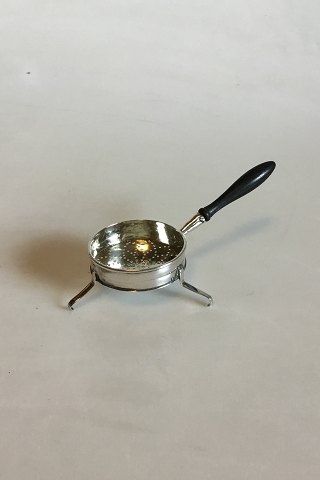 Early Tea Strainer with feet in Silver and Wood.
