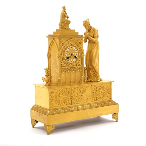 A gilt Empire mantel bronze clock. France circa 
1820. H: 49cm. W: 36cm