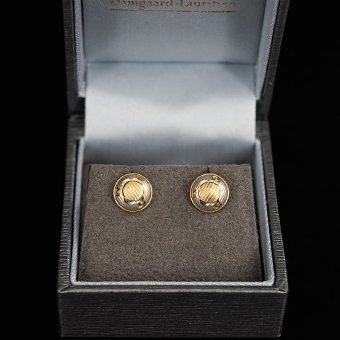 Earrings of 18k gold and white gold, round