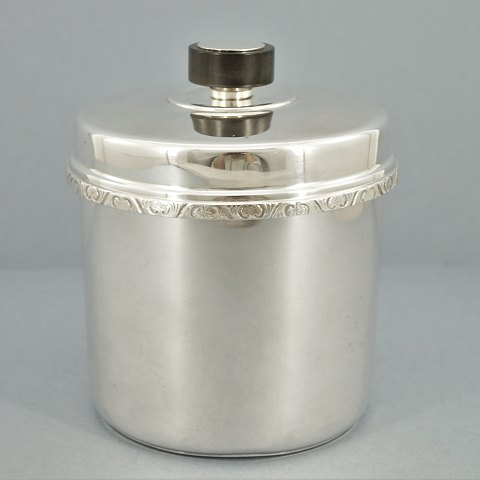 A silver tobacco jar