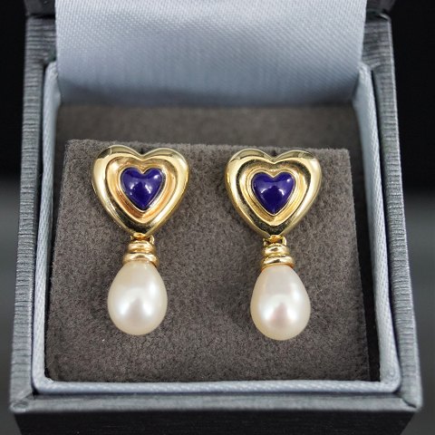 A pair of heart shaped earrings set with lapis lazuli and pearls, mounted in 14k 
gold
