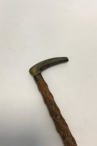 Antique Irish walking stick w.  head of carved antlers horn and shaft of black 
thorn. Collar of white metal, No ferule.