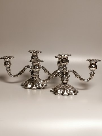 A pair of three-armed candlesticks of three-tower 
silver COHR