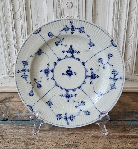 Royal Copenhagen Antique Blue Fluted plate ca year 1800.
Diameter 24 cm. 
Appears with chip.