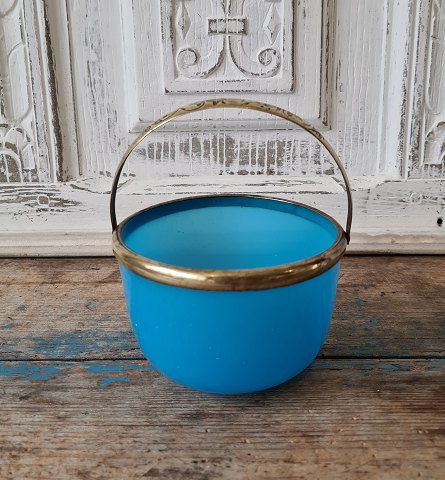 1800s sugar bowl in light blue opal glass with brass handle.