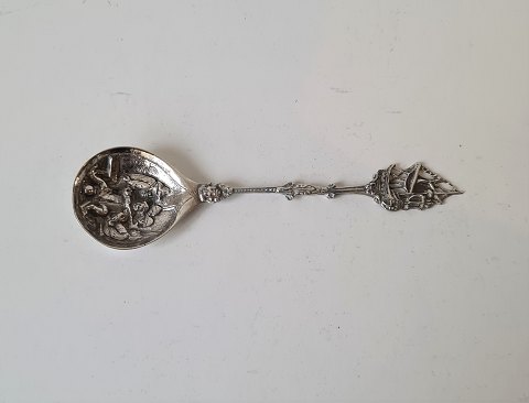 Sugar spoon in silver, richly decorated with ship on the shaft