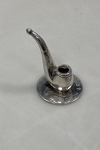 Miniature model of pipe in silver on base