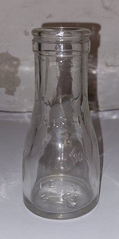 Small cream bottle in clear glass