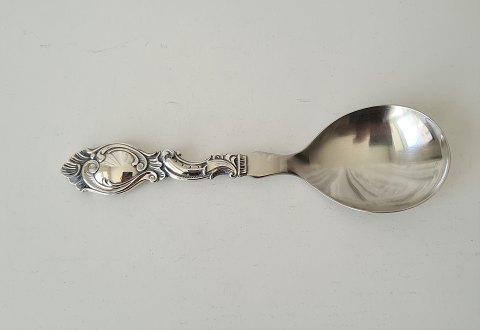 Serving spoon in silver and steel in rococo inspired design from Cohr 1951