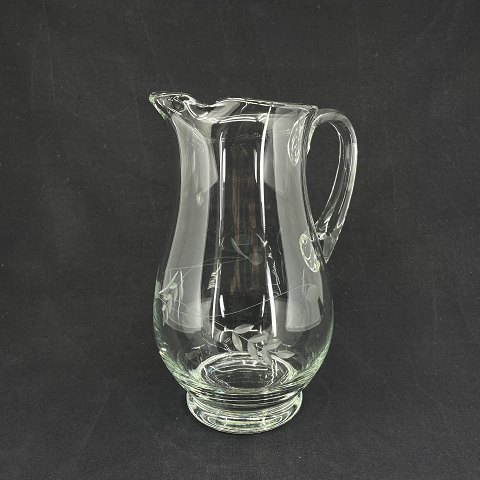 Glass jug with flowers