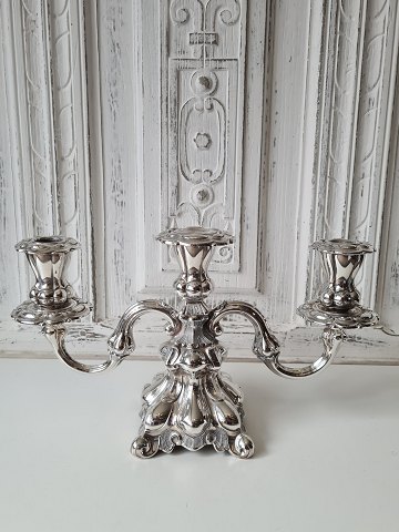 Three-armed silver candlestick in Rococo-inspired design