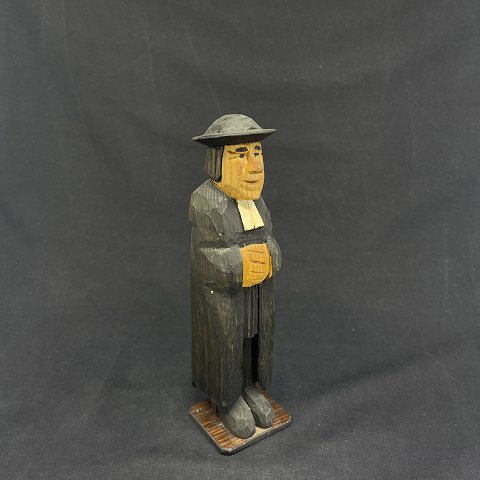 Carved wooden figure of priest