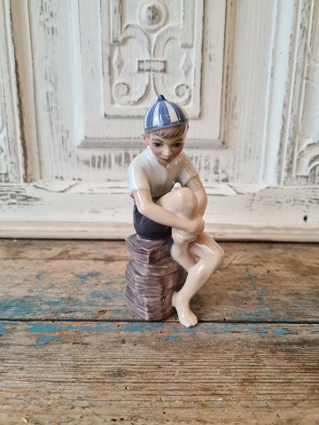 Dahl Jensen figure - Boy on stone no. 1328