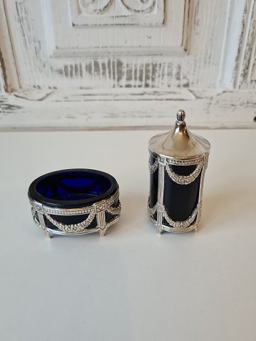 Salt and pepper shakers in sterling silver and blue glass produced in Sweden