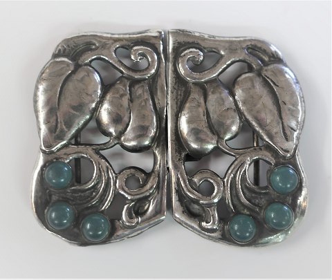 Jugend Silver belt buckle (830) with 6 green stones. Length 7 cm. Width 6 cm. 
Stamped 830S and IH.
