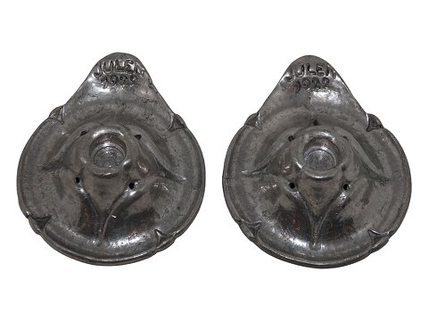 Small pewter candle light holders from the Christmas 1922