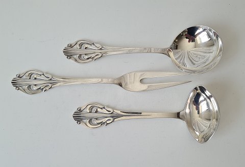 Serving set in silver consisting of sauce spoon, serving spoon and serving fork