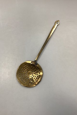 Antique brass skimming spoon