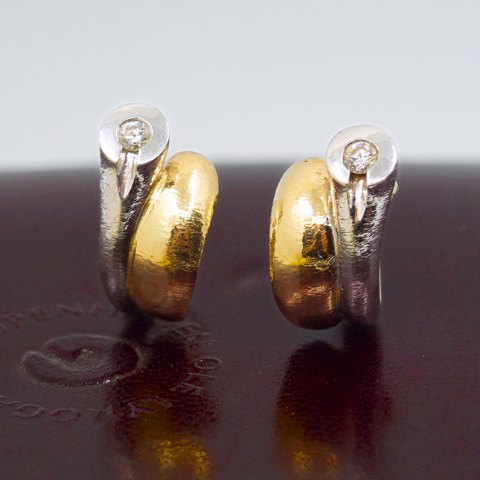 Ole Lynggaard; Pair of Fidelity earrings in 14k gold and white gold, set with diamonds