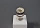 Håndlavet ring i 925 sterling sølv med marguerit top af A. Michelsen.
5000m2 udstilling.