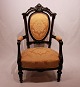 Armchair in the style Rokoko of mahogany and yellow fabric.
5000m2 showroom.