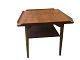 Table with hooked upwards sides and a shelf
Unknown
Teak wood
Width and length 60 cm, Height 61 cm
