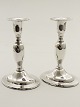 A pair of silver candlesticks