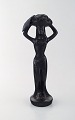 Scandinavian ceramist. Sculpture in black glazed ceramics. Woman carrying 
basket. 1960