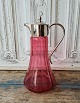 Beautiful wine jug in raspberry colored glass with silver plated mounting.