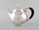 Johan Rohde for Georg Jensen. "Kosmos" teapot in sterling silver with ebony 
handle. Design 45A.
