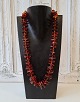 Long necklace in polished amber 61 cm.