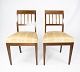 A pair of dining room chairs of mahogany with inlaid wood upholstered with light 
fabric from the 1920s.
5000m2 showroom.