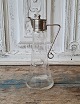 Small wine jug in glass with nickel-plated mounting, decorated with cuts of moon 
and stars 21 cm.