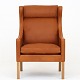 Børge Mogensen / Fredericia Furniture
BM 2204 - Rephosltered Wing-back chair in Klassik Cognac leather with legs in 
oak.
Availability: 6-8 weeks
Renovated
