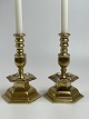 Pair of brass candlesticks in baroque style. Hexagonal with angels, weight 
approx. 2 kilos per candlestick
