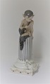 Royal Copenhagen. Porcelain figure. Faun with the rabbit. Model # 456. Height 21 
cm. (1 quality)