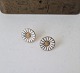 Anton Michelsen Marguerite - Daisy Earrings in gold-plated sterling silver and 
white enamel 11.6 mm.