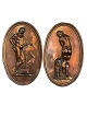 Two charming oval plaques for wall hanging made of copper with classic motifs of 
a woman and a man with a hunting dog, Venus and Mars