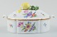 Nymphenburg, Germany, hand-painted porcelain lidded tureen with polychrome 
flowers, lid knob in the shape of a lemon.