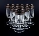 Murano, Italy, six mouth-blown and engraved dessert wine glasses with silver rim.