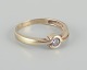 8 karat gold ring adorned with a small diamond. Modernist design.