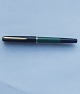 Green Pelikan fountain pen with black cap