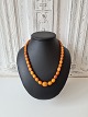 Long vintage necklace with polished oval amber beads - length 58 cm.