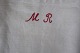 An old bag made of antique flax, with embroidery made by hand with a red 
signature "MR" 
This bag is a beautiful way to have your  laundry
65cm x 37cm
In a very good condition