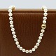 Ole Lynggaard; Clasp in 14k gold and white gold with pearl necklace