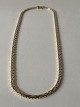 Antik Huset 
presents: 
Necklace 
in 8 carat 
gold, stamped 
333 with 3-rows 
brick pattern.