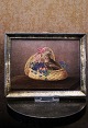 Decorative small 19th century painting with a motif of a pair of small Easter 
bunnies sitting in a flower basket...
