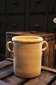 Old French glazed ceramic jar with handle and fine cream-colored glaze...